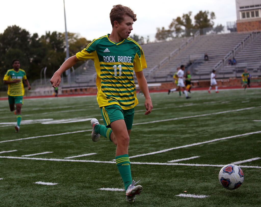 Rock Bridge sophomore Drew Schlimme chases a ball to keep it in bounds during a home game against the Marshall Owls
